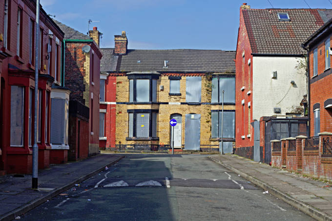 A street of boarded up houses